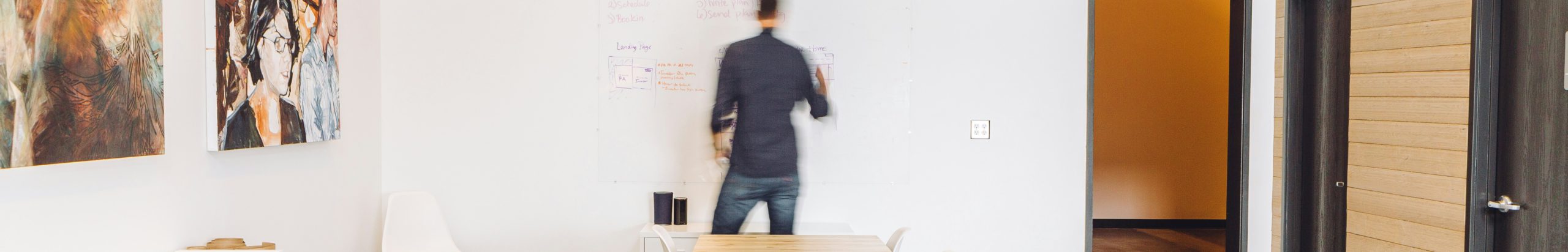imposter syndrome causes and how to overcome it blurred image of man at white board