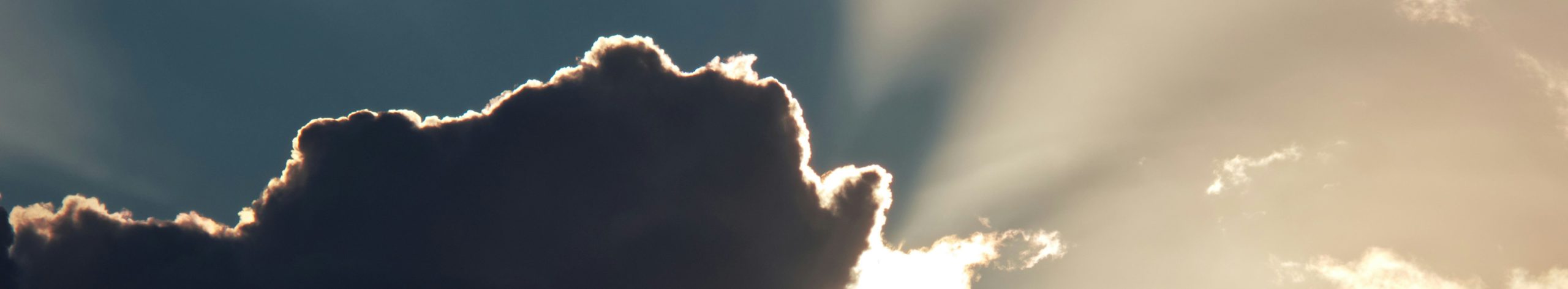 sun behind clouds, facing conflict